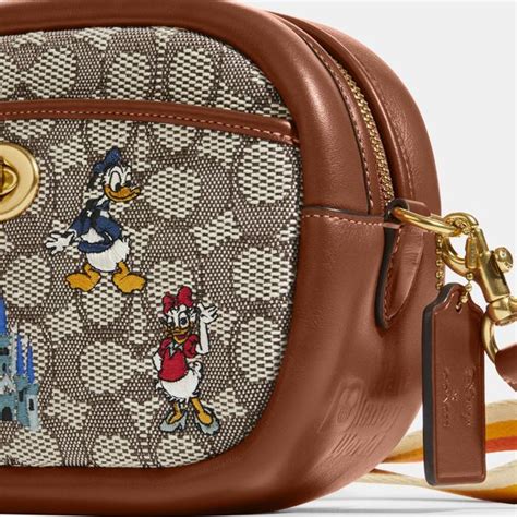 disney x coach camera bag.